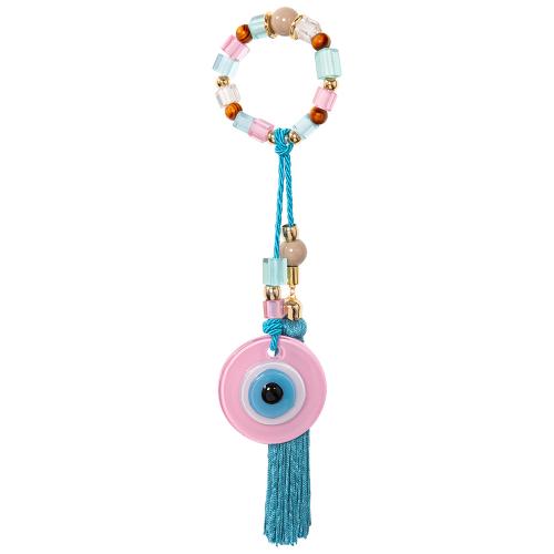 Lucky charm, yellow gold plated alloy glass evil eye, turquoise tassel. Length: 28cm.