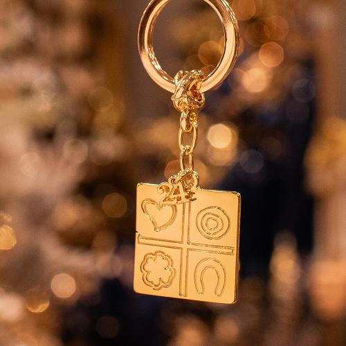 Charm - key ring 2024, yellow gold plated alloy.