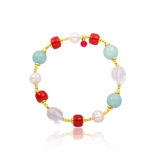 Bracelet with gold aimatite, coral and pearls.
