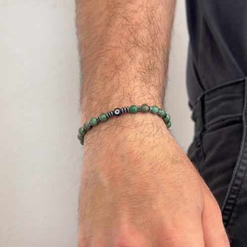 Men΄s silicone bracelet, green semi precious stones and evil eye.