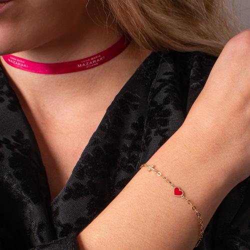 14K Yellow gold children's bracelet, white cubic zirconia cross and red enamel heart.