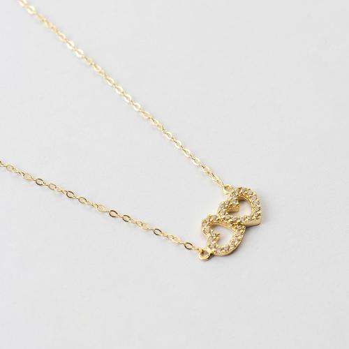 9K Yellow gold necklace, white cubic zirconia hearts.