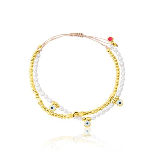 Yellow gold plated alloy beige macrame bracelet, evil eyes and pearls.