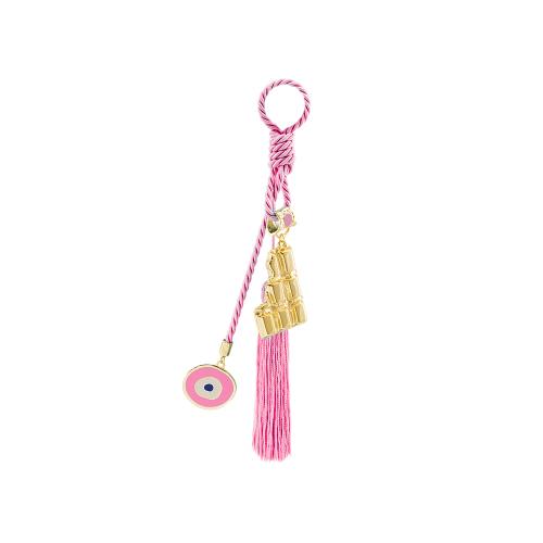 Yellow gold plated alloy baby charm, chocolate, evil eye and tassel.