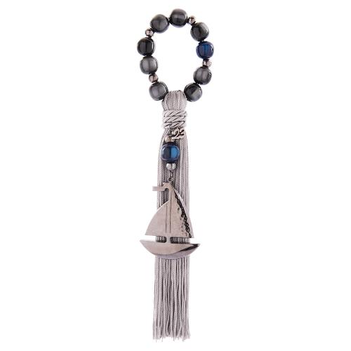 2023 Lucky charm, black rhodium plated alloy boat, blue and grey semi precious stones and tassel. Length: 25cm.