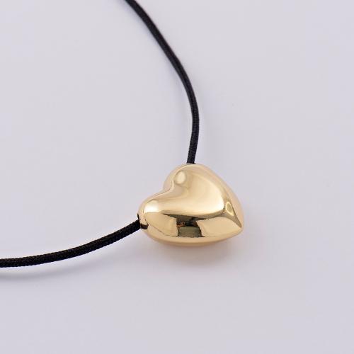 24K Yellow gold alloy necklace, black cord, heart and adjustable clasp.