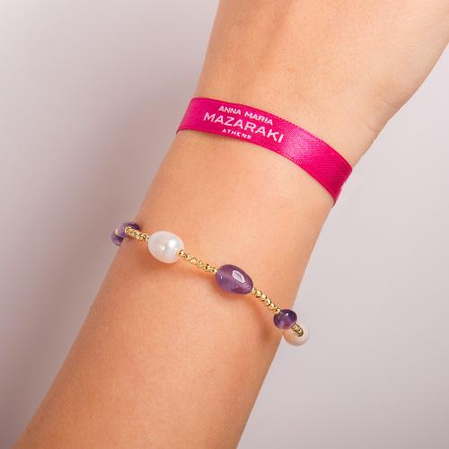 Silicone bracelet with gold aimatite, pearls and amethyst.