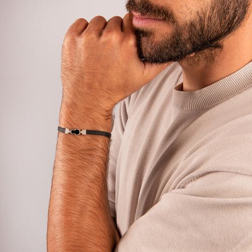 Unisex black rubber bracelet, sterling silver clasp and black enamel cross.